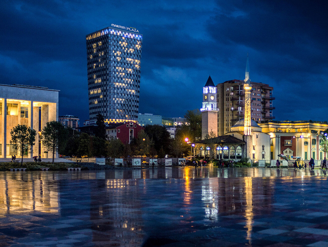 Night view of Skanderbeg Square with illuminated Maritim Hotel Plaza Tirana in the background
